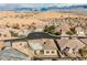 Stunning aerial shot of a residential street and houses with desert landscaping and mountain view at 479 Apogee, Mesquite, NV 89027