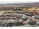 High angle view of the neighborhood homes with golf course, desert landscape and mountain views at 479 Apogee, Mesquite, NV 89027