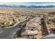 High angle view of a desert neighborhood surrounded by mountains in the distance with well kept streets at 479 Apogee, Mesquite, NV 89027