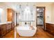 Soaking tub in a bright main bathroom, showcasing a glass shower, vanity, and skylight at 479 Apogee, Mesquite, NV 89027