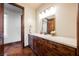 Bathroom with wooden cabinets, granite counters, doorway to shower/toilet room, plus sleek fixtures at 479 Apogee, Mesquite, NV 89027