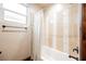 Bathroom featuring neutral tile shower walls with mosaic detail and classic plumbing fixtures at 479 Apogee, Mesquite, NV 89027