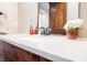 Modern bathroom vanity with custom wood cabinets, granite counters, and decorative glass soap dispensers at 479 Apogee, Mesquite, NV 89027