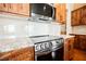Modern kitchen with stainless steel oven and granite countertops at 479 Apogee, Mesquite, NV 89027