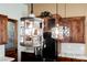 Kitchen featuring decorative pendant lighting, custom wood cabinets, and stainless steel refrigerator at 479 Apogee, Mesquite, NV 89027