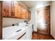 Laundry room features a washer, dryer, cabinets, counterspace, and a wood door at 479 Apogee, Mesquite, NV 89027