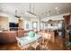 Open-concept living space featuring wood cabinets, an island, and cozy leather furniture at 479 Apogee, Mesquite, NV 89027