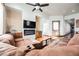 Spacious living room featuring a fireplace, comfortable seating, and abundant natural light at 479 Apogee, Mesquite, NV 89027