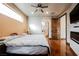 Bright main bedroom showcases a large window, modern fireplace, and bathroom access at 479 Apogee, Mesquite, NV 89027