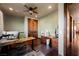 Inviting office with a ceiling fan, warm lighting and wood accents create a comfortable work environment at 479 Apogee, Mesquite, NV 89027
