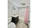 Bathroom featuring tiled floors, a sink, and a tub with a shower at 520 S 13Th St # D17, Las Vegas, NV 89101