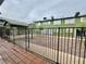 View of exterior of complex from behind fence at 520 S 13Th St # D17, Las Vegas, NV 89101