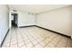 Spacious living room featuring neutral walls, tiled flooring, and ample natural light at 520 S 13Th St # D17, Las Vegas, NV 89101