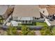 Aerial view of a home with a well-maintained backyard, a covered patio, and a tile roof at 580 Kenerly St, Henderson, NV 89015