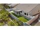This aerial view showcases the property's landscaped backyard with a covered patio and well-maintained lawn at 580 Kenerly St, Henderson, NV 89015