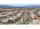 Community aerial view showcasing homes, walking trails and a stunning pool in a well-maintained neighborhood at 580 Kenerly St, Henderson, NV 89015