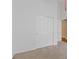 Spacious bedroom with neutral carpet and sliding closet doors for easy access and storage at 580 Kenerly St, Henderson, NV 89015