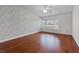 Serene bedroom with hardwood floors and a decorative accent wall at 580 Kenerly St, Henderson, NV 89015