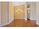 Formal dining room featuring hardwood floors and an elegant chandelier at 580 Kenerly St, Henderson, NV 89015