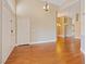 Inviting entryway with gleaming hardwood floors and a charming chandelier at 580 Kenerly St, Henderson, NV 89015