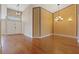 Spacious entryway with hardwood floors and a decorative chandelier at 580 Kenerly St, Henderson, NV 89015