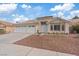 Charming single-story home with well-maintained landscaping, two-car garage, and inviting curb appeal at 580 Kenerly St, Henderson, NV 89015