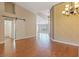 Open-concept living space with hardwood floors and a sliding barn door at 580 Kenerly St, Henderson, NV 89015