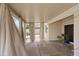 Covered patio area featuring neutral toned curtains for added privacy and a cozy atmosphere for outdoor relaxation and entertaining at 580 Kenerly St, Henderson, NV 89015