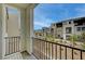 Balcony view showcasing the community's modern architecture and desert landscape at 6261 Dolosonte St, Las Vegas, NV 89113