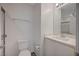 Bathroom featuring a toilet, vanity with mirror, and towel rack at 6261 Dolosonte St, Las Vegas, NV 89113