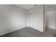 Bedroom featuring gray carpet, white walls and closet with sliding doors at 6261 Dolosonte St, Las Vegas, NV 89113