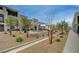 Community space with picnic tables, a gazebo, desert landscaping, and walkways at 6261 Dolosonte St, Las Vegas, NV 89113