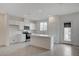 Contemporary kitchen with white cabinets, stainless steel appliances, and an island at 6261 Dolosonte St, Las Vegas, NV 89113
