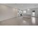 Open-concept living area features tile flooring, recessed lights, stainless appliances and an island with quartz countertop at 6261 Dolosonte St, Las Vegas, NV 89113
