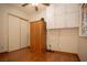 This bedroom features hardwood floors and a large closet, and built-in cabinets for storage at 7233 Alsop Ct, Las Vegas, NV 89156