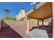 Covered patio and desert-landscaped backyard with privacy wall create a private outdoor space at 7337 Tealwood St, Las Vegas, NV 89131