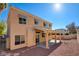 Two-story home featuring an outdoor covered patio and a private backyard with desert landscaping at 7337 Tealwood St, Las Vegas, NV 89131