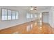 Open bedroom has ceiling fan, hardwood floors, and mirrored closet at 7337 Tealwood St, Las Vegas, NV 89131