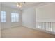 Bright bedroom with carpeted floors, natural light, and a view of the loft area at 7337 Tealwood St, Las Vegas, NV 89131