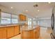 Charming kitchen features an island, stainless steel appliances, and bright lighting at 7337 Tealwood St, Las Vegas, NV 89131
