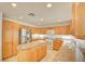 Bright kitchen with an island, granite countertops, and stainless steel appliances at 7337 Tealwood St, Las Vegas, NV 89131