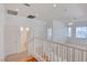 Second floor landing area with hardwood stairs, view of downstairs, and bathroom at 7337 Tealwood St, Las Vegas, NV 89131