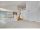 Bright living room with vaulted ceilings, neutral carpet, and staircase at 7337 Tealwood St, Las Vegas, NV 89131