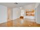 Spacious living room with beautiful hardwood floors, natural light, and an open floor plan at 7337 Tealwood St, Las Vegas, NV 89131