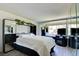 Bright bedroom with mirrored walls, built-in shelving, and a serene atmosphere at 750 S Royal Crest Cir # 346, Las Vegas, NV 89169