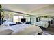 Spacious bedroom featuring mirrored walls, natural light, and contemporary furnishings at 750 S Royal Crest Cir # 346, Las Vegas, NV 89169