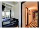 Eclectic hallway showcasing checkered floors, a modern wet bar, and access to bright, airy spaces at 750 S Royal Crest Cir # 346, Las Vegas, NV 89169