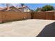 Enclosed backyard with a concrete patio area bordered by brick walls at 7728 Barbican Ct, Las Vegas, NV 89147