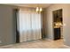 Bright dining area with natural lighting and view to kitchen at 7728 Barbican Ct, Las Vegas, NV 89147