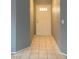 Bright entryway featuring neutral walls and tile flooring leading inside the home at 7728 Barbican Ct, Las Vegas, NV 89147